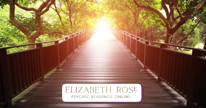 a wooden bridge leading into bright light, symbolising life path readings