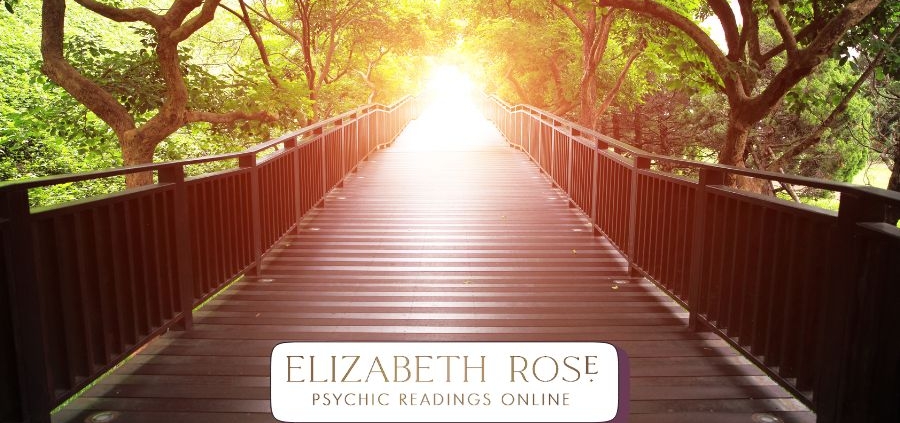 a wooden bridge leading into bright light, symbolising life path readings