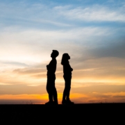 divorcesquare1 2 silhouettes in the sunset with their backs to each other insinuating they are parting ways