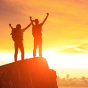 psychic-men1 Two male silhouettes standing on the edge of a rock in the sunset